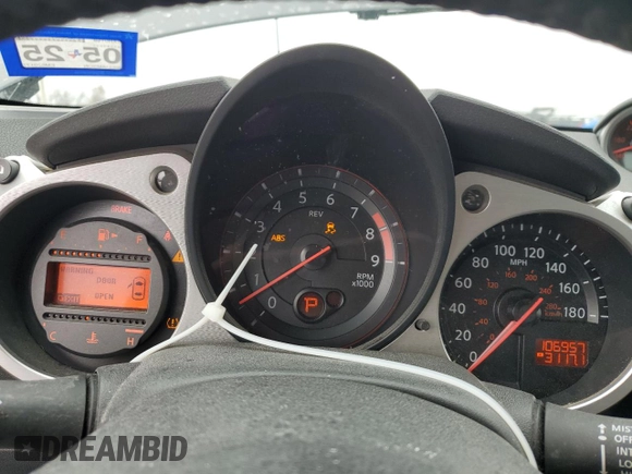 2014 Nissan 370Z Touring with VIN JN1AZ4FH1EM620177, listed as a Copart auction lot 42581255 with 106,957 mi miles and Salvage Title. Bid and sale history available at DreamBid. Image 9.