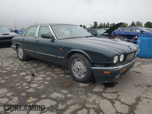 1996 Jaguar XJ with VIN SAJHX1741TC758740, listed as a Copart auction lot 73377914 with 140,964 mi miles and Salvage title. Bid and sale history available at DreamBid. Image 4.