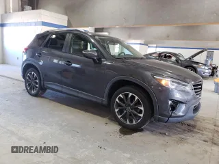 2016 Mazda CX-5 Grand Touring with VIN JM3KE4DY8G0616421, listed as a Copart auction lot 50884525 with 182,048 mi miles and Salvage Title. Bid and sale history available at DreamBid. Image 4.
