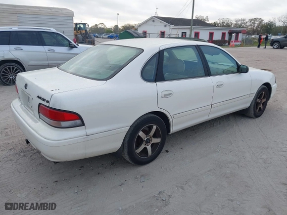 1997 Toyota Avalon XL with VIN 4T1BF12B1VU144017, listed as a IAAI auction lot 41602761 with 163,955 mi miles. Bid and sale history available at carsss.com. Image 4.