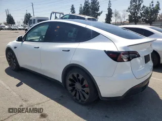 2022 Tesla Model Y Performance with VIN 7SAYGDEFXNF407340, listed as a Copart auction lot 54376895 with 56,709 mi miles and Salvage Title. Bid and sale history available at DreamBid. Image 2.