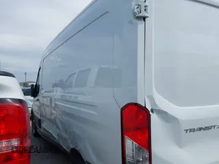 2019 Ford Transit with VIN 1FTYR2CM3KKB86806, listed as a IAAI auction lot 42633294 with 148,555 mi miles and . Bid and sale history available at DreamBid. Image 14.