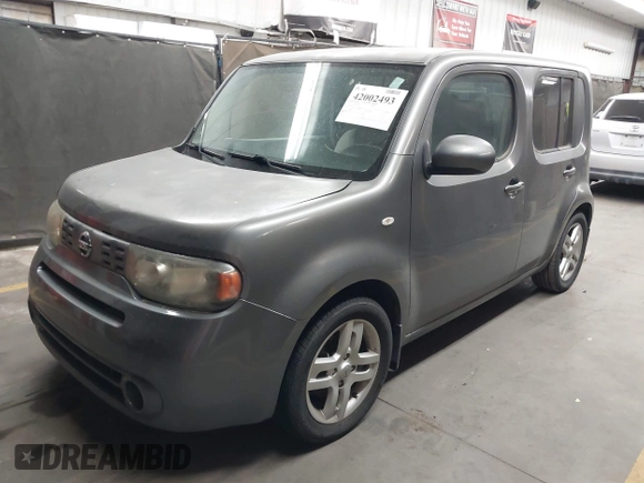 2011 Nissan Cube 1.8 SL with VIN JN8AZ2KR2BT212311, listed as a IAAI auction lot 42002493 with 128,372 mi miles. Bid and sale history available at carsss.com. Image 2.