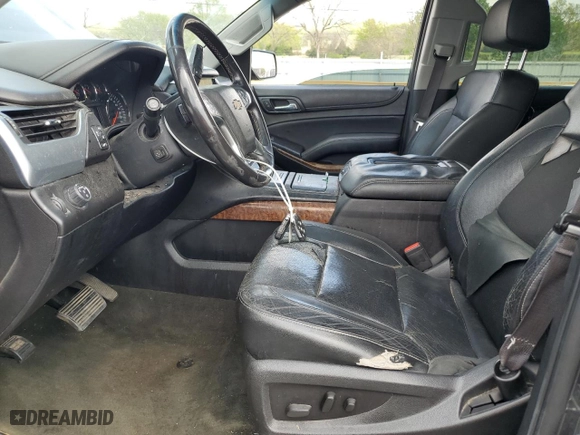 2015 Chevrolet Suburban LTZ with VIN 1GNSCKKCXFR216890, listed as a Copart auction lot 52695155 with 233,296 mi miles and Clean Title. Bid and sale history available at carsss.com. Image 7.