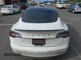 2019 Tesla Model 3 Mid Range with VIN 5YJ3E1EA6KF396946, listed as a IAAI auction lot 41123058 with 69,013 mi miles and . Bid and sale history available at carsss.com. Image 17.