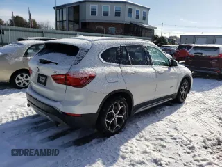 2017 BMW X1 xDrive28i with VIN WBXHT3C33H5F77000, listed as a Copart auction lot 41860993 with 113,553 mi miles. Bid and sale history available at carsss.com. Image 3.
