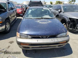 1996 Subaru Impreza Outback with VIN JF1GF4851TG811571, listed as a Copart auction lot 65650514 with 248,315 mi miles and Salvage title. Bid and sale history available at DreamBid. Image 5.