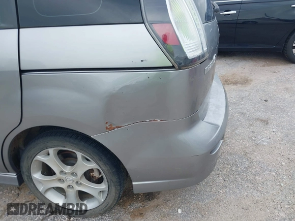2010 Mazda 5 Sport with VIN JM1CR2WL8A0387155, listed as a IAAI auction lot 42773874 with 146,418 mi miles and . Bid and sale history available at DreamBid. Image 6.