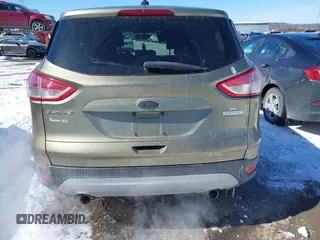 2013 Ford Escape SE with VIN 1FMCU0GX4DUC60741, listed as a IAAI auction lot 41592770 with 121,972 mi miles and . Bid and sale history available at DreamBid. Image 16.