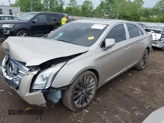 2014 Cadillac XTS Platinum z VIN 2G61T5S31E9209179, wystawiony jako IAAI lot #42241440 z przebiegiem 79 651 mil mil oraz . Historia ofert i sprzedaży dostępna na DreamBid. Obrazek 2.