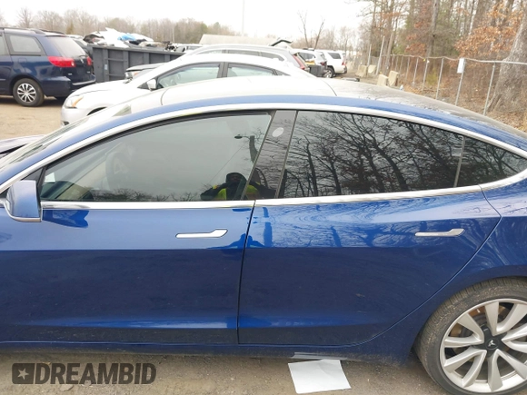 2019 Tesla Model 3 Long Range with VIN 5YJ3E1EB9KF454007, listed as a IAAI auction lot 41769346 with 141,609 mi miles. Bid and sale history available at carsss.com. Image 14.