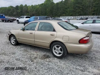 2001 Mazda 626 LX z VIN 1YVGF22C715202574, wystawiony jako Copart lot #54132915 z przebiegiem 237 041 mil mil oraz Szkody całkowita. Historia ofert i sprzedaży dostępna na DreamBid. Obrazek 2.