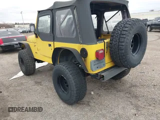 2000 Jeep Wrangler Sport with VIN 1J4FA49S0YP781831, listed as a IAAI auction lot 41694680 with 250,108 mi miles and . Bid and sale history available at DreamBid. Image 3.