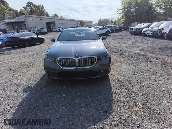 2024 BMW i5 eDrive40 with VIN WBY33FK05RCR58520, listed as a Copart auction lot 77179704 with 16 mi miles and Salvage Title. Bid and sale history available at carsss.com. Image 5.