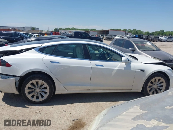 2017 Tesla Model S 100D with VIN 5YJSA1E20HF232570, listed as a IAAI auction lot 42037409 with 68,957 mi miles and . Bid and sale history available at DreamBid. Image 13.