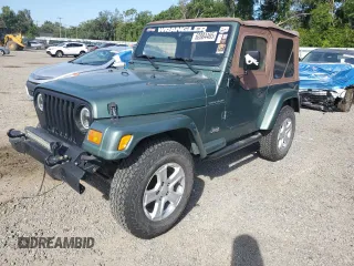 2000 Jeep Wrangler SE with VIN 1J4FA29P6YP741673, listed as a Copart auction lot 62884465 with Not provided miles and Salvage title. Bid and sale history available at DreamBid. Image 1.