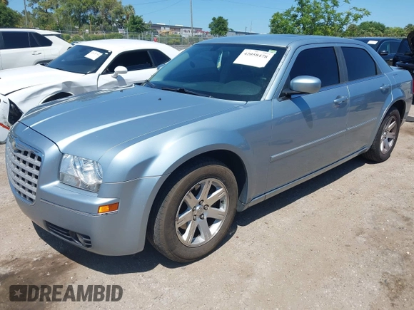2006 Chrysler 300 Touring with VIN 2C3KA53G56H324954, listed as a IAAI auction lot 42058478 with 124,933 mi miles. Bid and sale history available at carsss.com. Image 2.