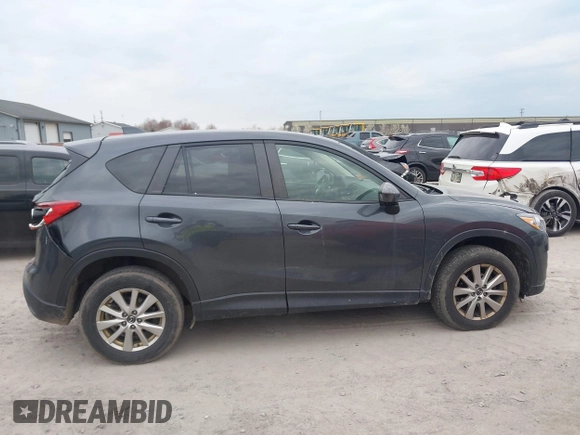 2015 Mazda CX-5 Touring with VIN JM3KE4CY1F0439016, listed as a IAAI auction lot 42039259 with 201,325 mi miles and . Bid and sale history available at carsss.com. Image 13.