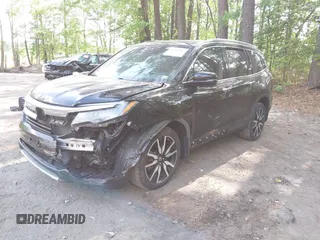 2019 Honda Pilot Touring 7-Passenger with VIN 5FNYF6H60KB030990, listed as a IAAI auction lot 42160762 with 68,807 mi miles and . Bid and sale history available at DreamBid. Image 17.