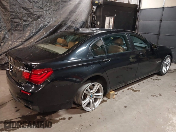 2014 BMW 7 Series ALPINA B7 xDrive with VIN WBAYF8C53ED141858, listed as a IAAI auction lot 40987098 with 128,404 mi miles and . Bid and sale history available at DreamBid. Image 4.