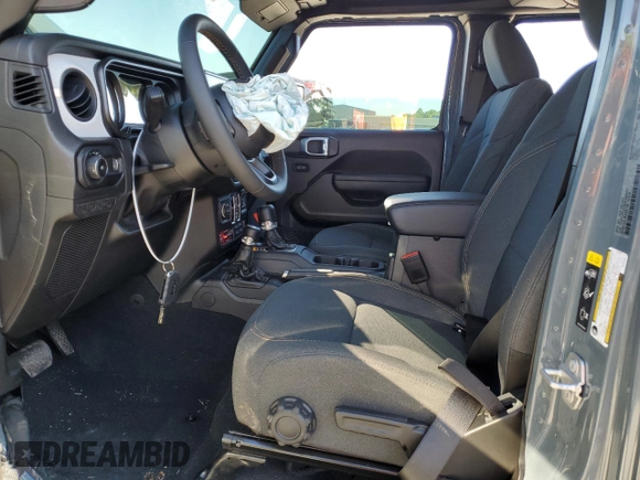 2024 Jeep Wrangler Sport S with VIN 1C4PJXDG2RW346671, listed as a Copart auction lot 57966375 with 9,430 mi miles and Salvage title. Bid and sale history available at DreamBid. Image 7.