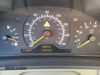 1999 Mercedes-Benz E-Class with VIN WDBJH82F4XX026758, listed as a Copart auction lot 76740804 with 136,782 mi miles and Salvage Title. Bid and sale history available at carsss.com. Image 9.