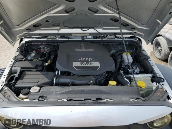 2012 Jeep Wrangler Unlimited Sport z VIN 1C4BJWDG8CL220960, wystawiony jako Copart lot #57823315 z przebiegiem 177 541 mil mil oraz Szkoda całkowita • Salvage title. Historia ofert i sprzedaży dostępna na DreamBid. Obrazek 12.