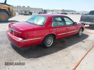 1999 Mercury Grand Marquis GS z VIN 2MEFM74W2XX635561, wystawiony jako IAAI lot #41982451 z przebiegiem 233 137 mil mil oraz . Historia ofert i sprzedaży dostępna na DreamBid. Obrazek 4.