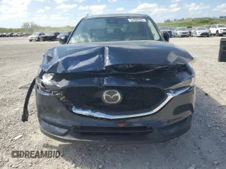 2021 Mazda CX-5 Grand Touring with VIN JM3KFADM1M0301366, listed as a Copart auction lot 52890955 with 66,686 mi miles and Non Repairable. Bid and sale history available at carsss.com. Image 5.