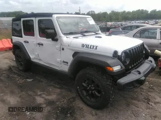 2021 Jeep Wrangler Unlimited Sport S with VIN 1C4HJXDG8MW597448, listed as a IAAI auction lot 42132171 with 77,307 mi miles and . Bid and sale history available at DreamBid. Image 1.