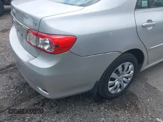 2013 Toyota Corolla L with VIN 2T1BU4EEXDC052854, listed as a IAAI auction lot 42230118 with 156,120 mi miles and . Bid and sale history available at DreamBid. Image 6.