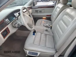 1995 Cadillac DeVille z VIN 1G6KD52B0SU252838, wystawiony jako Copart lot #87642595 z przebiegiem 72 847 mil mil oraz Szkoda całkowita • Salvage title. Historia ofert i sprzedaży dostępna na DreamBid. Obrazek 7.