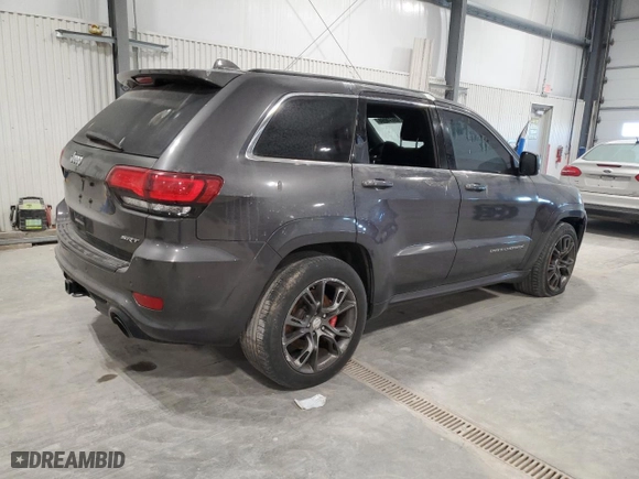 2015 Jeep Grand Cherokee SRT with VIN 1C4RJFDJ8FC752210, listed as a Copart auction lot 88773005 with 76,721 mi miles and Salvage Title. Bid and sale history available at carsss.com. Image 3.
