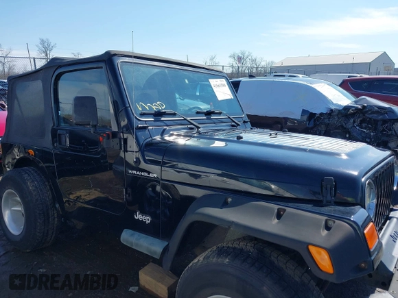 2002 Jeep Wrangler X with VIN 1J4FA39S52P770664, listed as a IAAI auction lot 41661580 with 122,445 mi miles. Bid and sale history available at carsss.com. Image 13.
