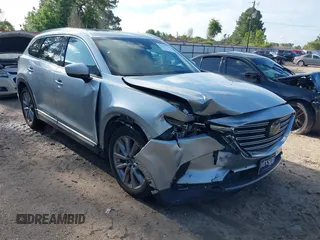 2020 Mazda CX-9 Grand Touring z VIN JM3TCADY2L0406173, wystawiony jako IAAI lot #42217230 z przebiegiem 110 465 mil mil oraz . Historia ofert i sprzedaży dostępna na DreamBid. Obrazek 1.