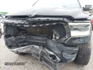 2019 Ram 1500 Rebel z VIN 1C6SRFLT1KN722064, wystawiony jako IAAI lot #41513201 z przebiegiem 113 559 mil mil oraz . Historia ofert i sprzedaży dostępna na DreamBid. Obrazek 21.