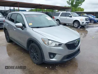 2014 Mazda CX-5 Touring z VIN JM3KE2CY8E0369145, wystawiony jako IAAI lot #42462985 z przebiegiem 155 480 mil mil oraz . Historia ofert i sprzedaży dostępna na DreamBid. Obrazek 1.