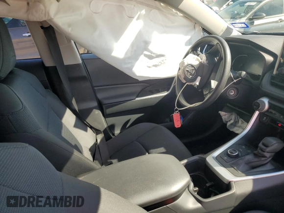2023 Toyota RAV4 Hybrid LE with VIN JTMLWRFV0PD207803, listed as a Copart auction lot 55694695 with 13,198 mi miles and Salvage title. Bid and sale history available at DreamBid. Image 7.