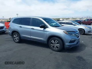 2016 Honda Pilot LX with VIN 5FNYF5H10GB044006, listed as a IAAI auction lot 42075404 with 129,642 mi miles and . Bid and sale history available at DreamBid. Image 1.