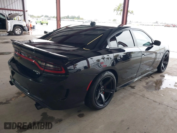 2019 Dodge Charger SRT Hellcat with VIN 2C3CDXL97KH552439, listed as a IAAI auction lot 41813879 with 58,921 mi miles and . Bid and sale history available at DreamBid. Image 4.