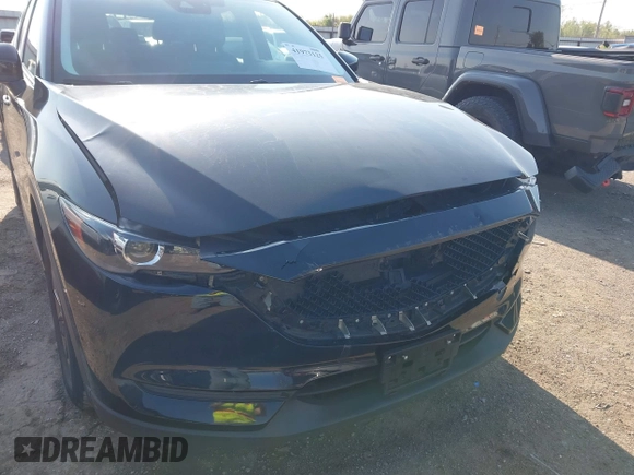 2019 Mazda CX-5 Touring with VIN JM3KFACM6K0533203, listed as a IAAI auction lot 41973125 with 106,882 mi miles and . Bid and sale history available at carsss.com. Image 6.