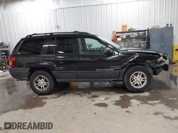 2004 Jeep Grand Cherokee Laredo with VIN 1J4GW48N84C367215, listed as a IAAI auction lot 41352098 with 165,485 mi miles and . Bid and sale history available at DreamBid. Image 13.
