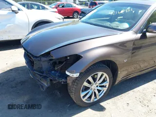 2015 Infiniti Q70 z VIN JN1BY1AR1FM560845, wystawiony jako IAAI lot #42165981 z przebiegiem 75 767 mil mil oraz . Historia ofert i sprzedaży dostępna na DreamBid. Obrazek 19.