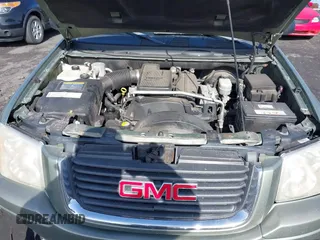 2004 GMC Envoy SLE with VIN 1GKDT13S942254932, listed as a IAAI auction lot 41509407 with 213,068 mi miles. Bid and sale history available at carsss.com. Image 10.