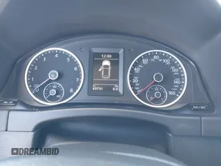 2014 Volkswagen Tiguan S z VIN WVGBV3AX4EW581302, wystawiony jako IAAI lot #41033175 z przebiegiem 69 791 mil mil oraz . Historia ofert i sprzedaży dostępna na DreamBid. Obrazek 7.