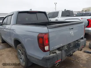 2023 Honda Ridgeline RTL-E with VIN 5FPYK3F70PB030718, listed as a IAAI auction lot 41667869 with 18,768 mi miles. Bid and sale history available at carsss.com. Image 3.