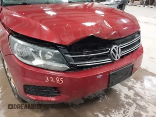 2014 Volkswagen Tiguan S z VIN WVGBV3AXXEW045826, wystawiony jako IAAI lot #42173285 z przebiegiem 126 260 mil mil oraz . Historia ofert i sprzedaży dostępna na DreamBid. Obrazek 6.