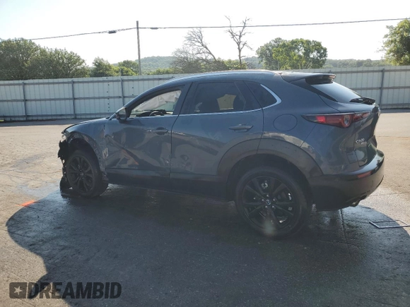 2023 Mazda CX-30 S Carbon Edition with VIN 3MVDMBCM1PM553374, listed as a Copart auction lot 62080975 with 51,527 mi miles and Salvage title. Bid and sale history available at DreamBid. Image 2.
