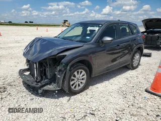 2014 Mazda CX-5 Sport z VIN JM3KE2BE8E0421316, wystawiony jako Copart lot #56548005 z przebiegiem 203 096 mil mil oraz Szkoda całkowita • Salvage title. Historia ofert i sprzedaży dostępna na DreamBid. Obrazek 1.