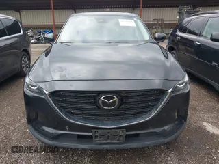 2023 Mazda CX-9 Touring Plus with VIN JM3TCBAY2P0657825, listed as a IAAI auction lot 42756562 with 52,090 mi miles and . Bid and sale history available at DreamBid. Image 12.